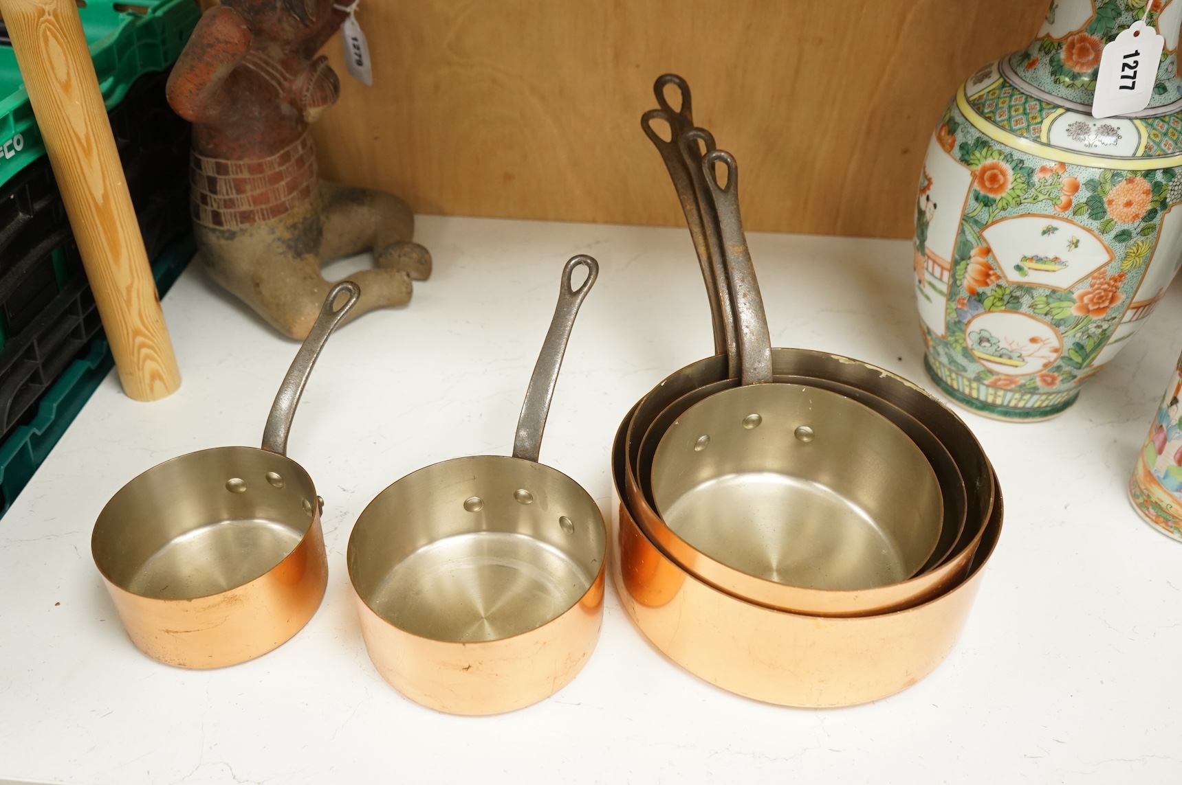 A graduated set of six French Tournus copper cooking pans, largest 44cm wide